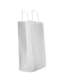 Photo of Mockup of paper shopping bag on white background