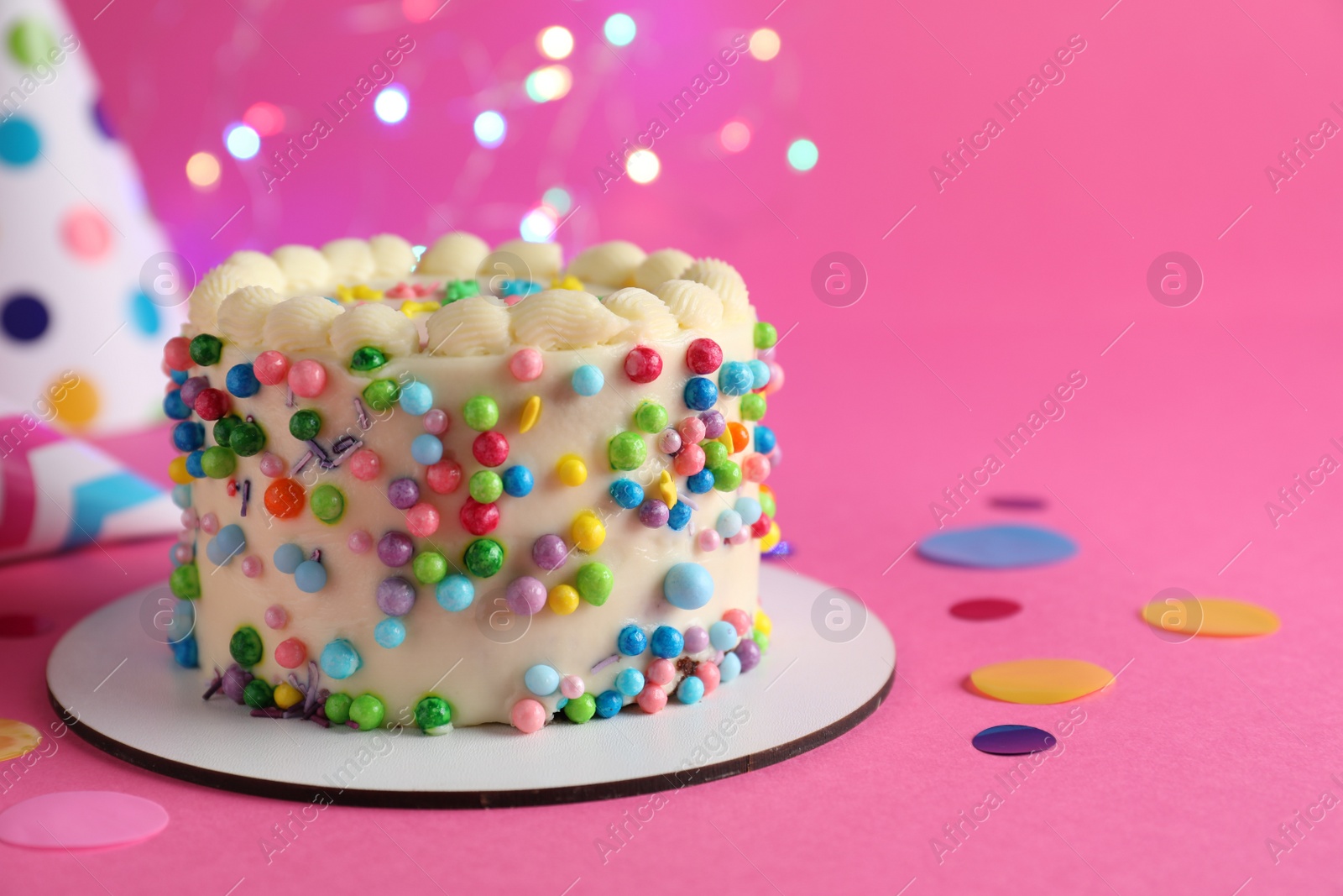 Photo of Cute bento cake with tasty cream and decor on pink background, space for text