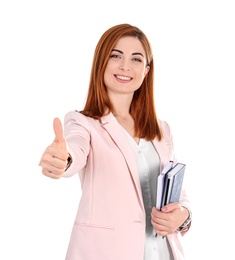 Photo of Beautiful young teacher with notebooks on white background