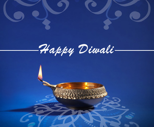 Image of Inscription Happy Diwali and clay lamp on color background