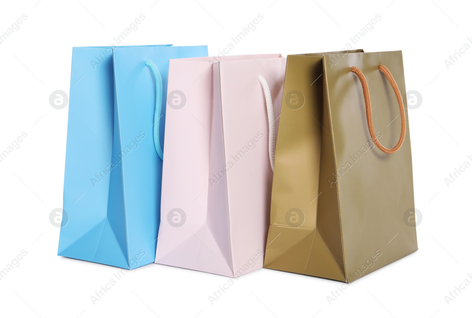 Photo of Colorful paper shopping bags isolated on white