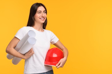 Architect with hard hat and drafts on yellow background, space for text