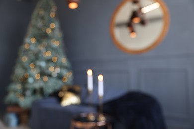 Photo of Blurred view of living room interior with Christmas tree and festive decor