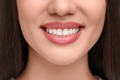 Photo of Smiling woman with clean teeth, closeup view
