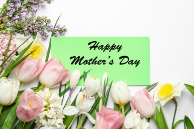 Image of Card with text Happy Mother's Day and beautiful flowers on white background, flat lay