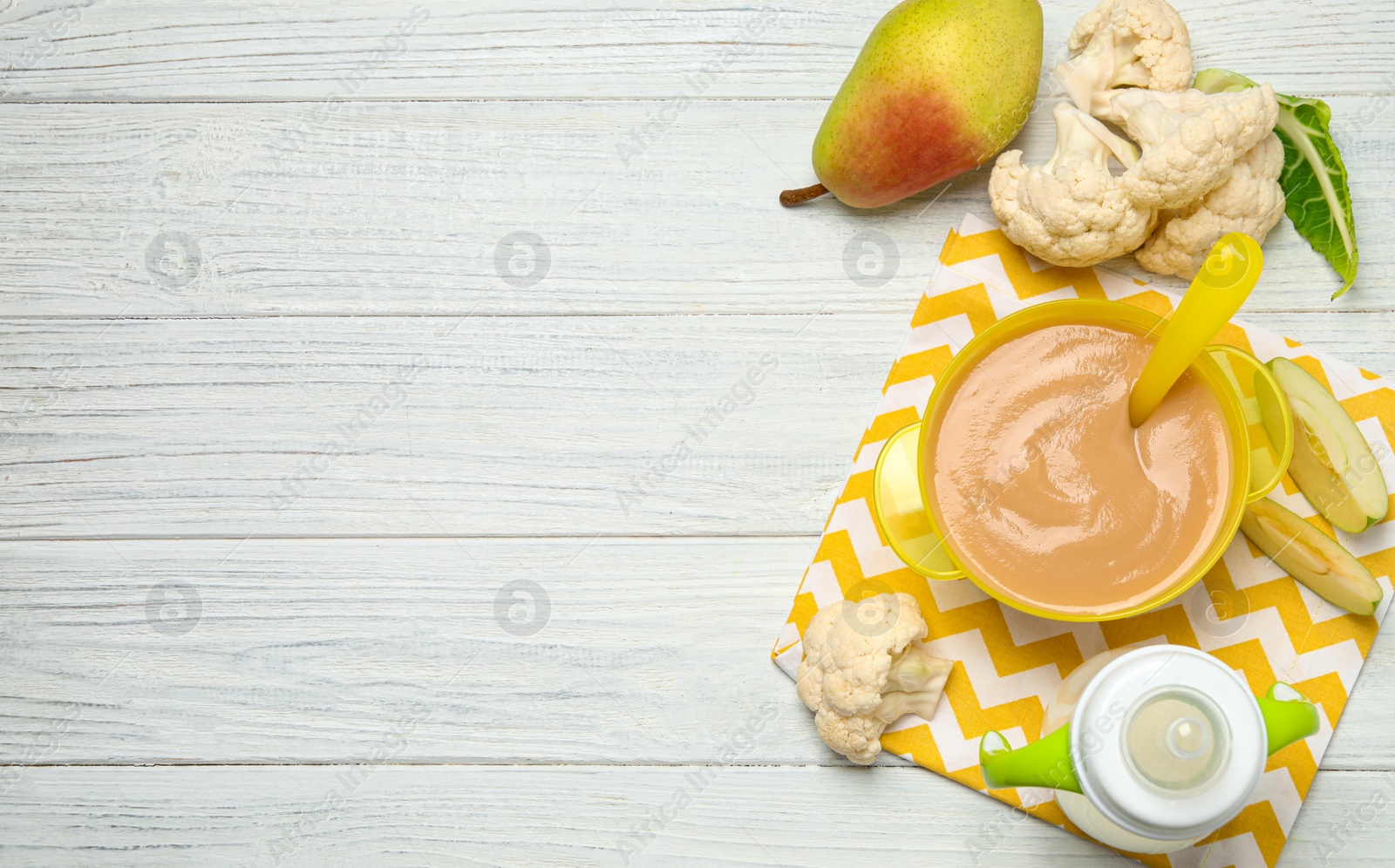 Photo of Healthy baby food and ingredients on white wooden table, flat lay. Space for text