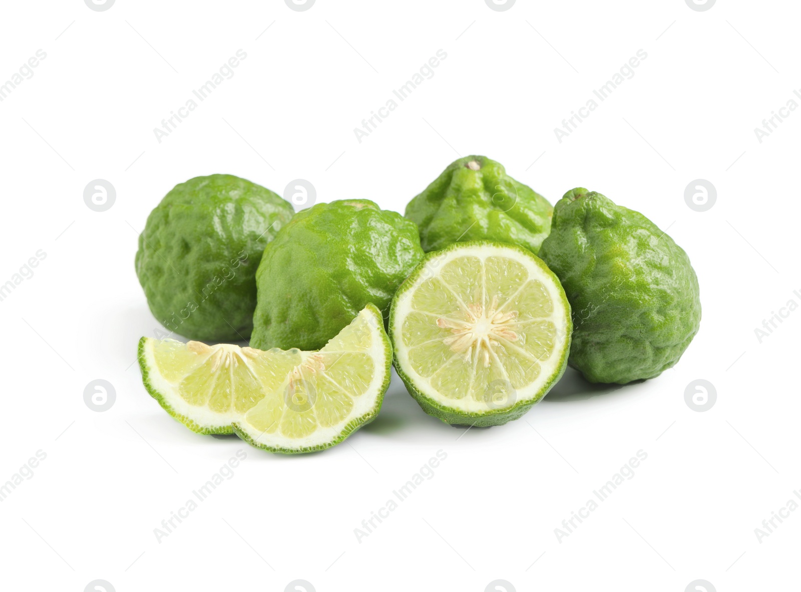 Photo of Whole and cut ripe bergamot fruits on white background