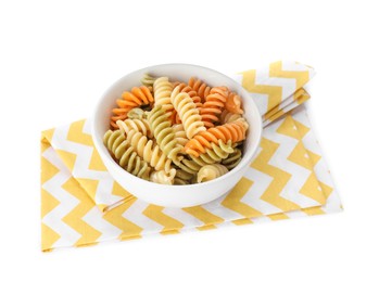 Bowl with tasty fusilli pasta and towel on white background