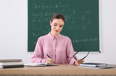 Photo of Portrait of young female teacher in classroom