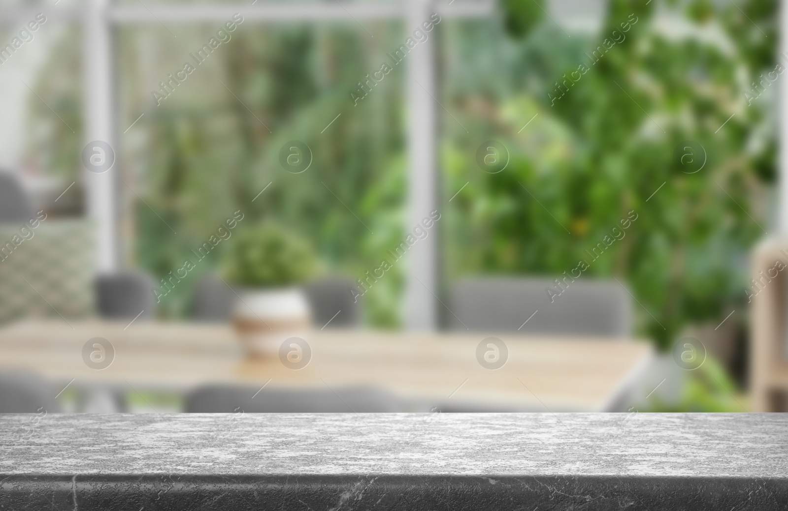 Image of Empty grey stone surface and blurred view of modern window 