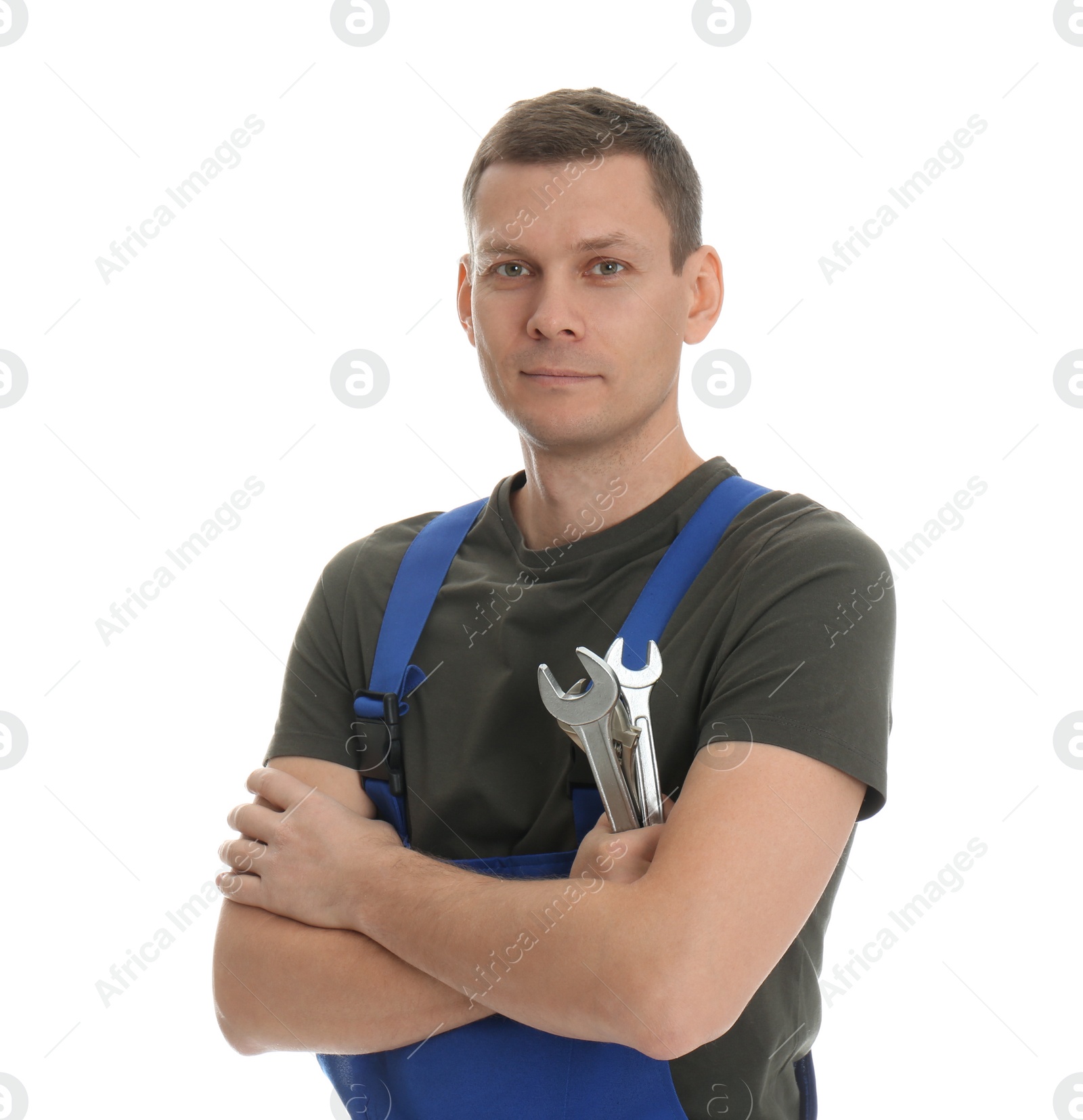 Photo of Portrait of professional auto mechanic with wrenches on white background