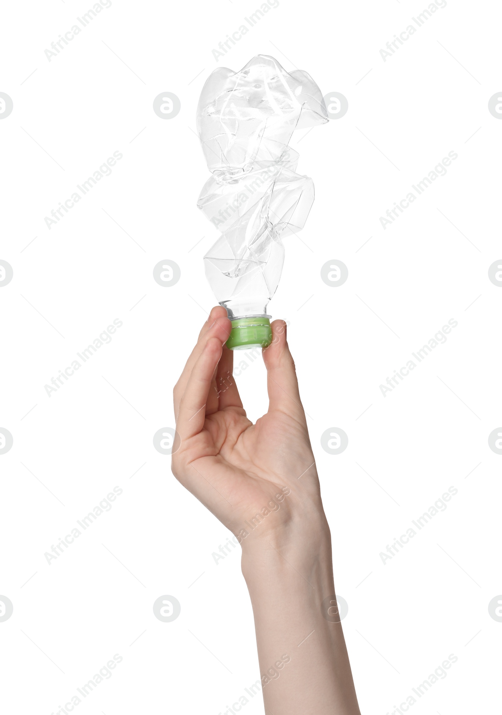 Photo of Woman holding crumpled plastic bottle on white background, closeup