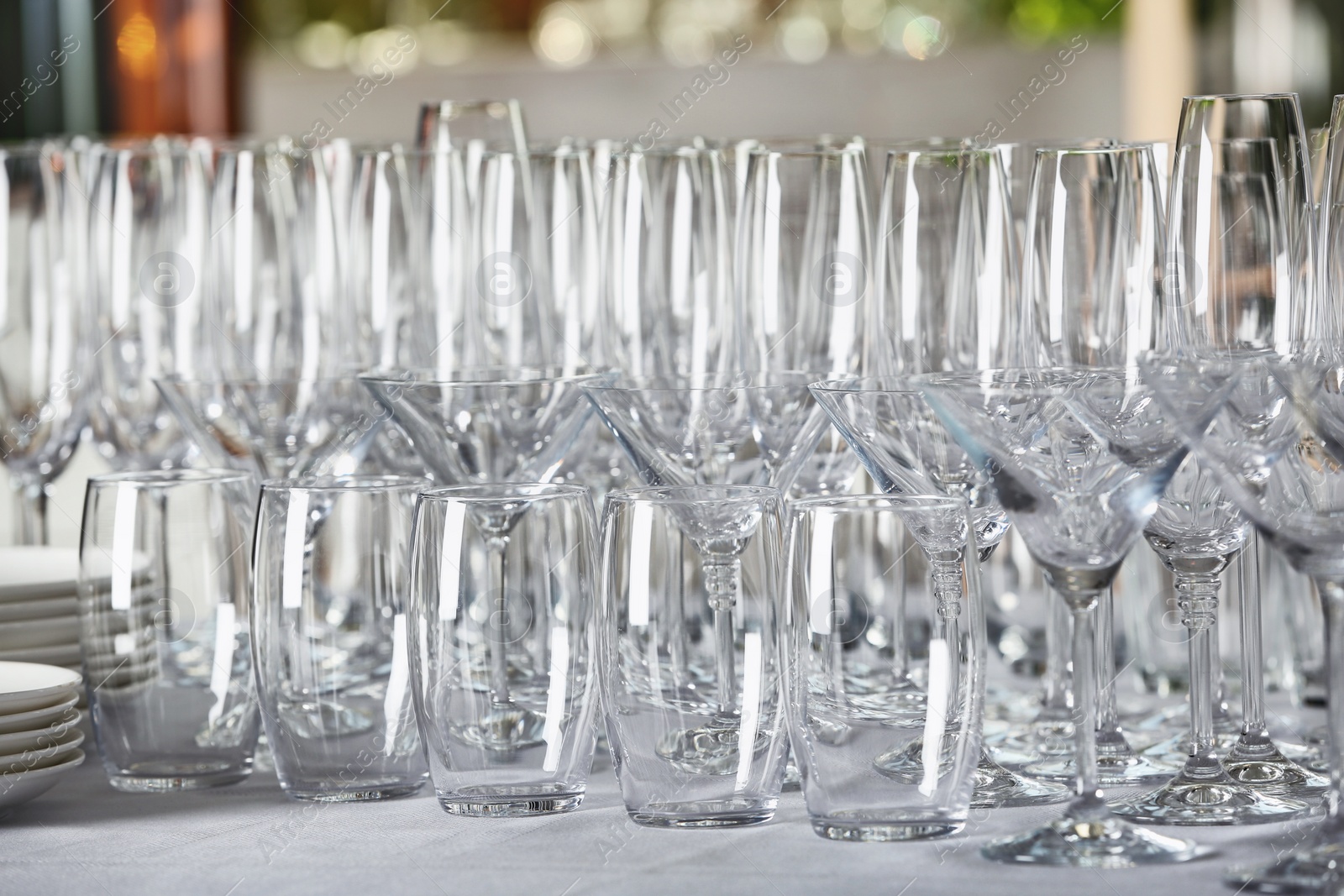 Photo of Set of empty glasses on table indoors