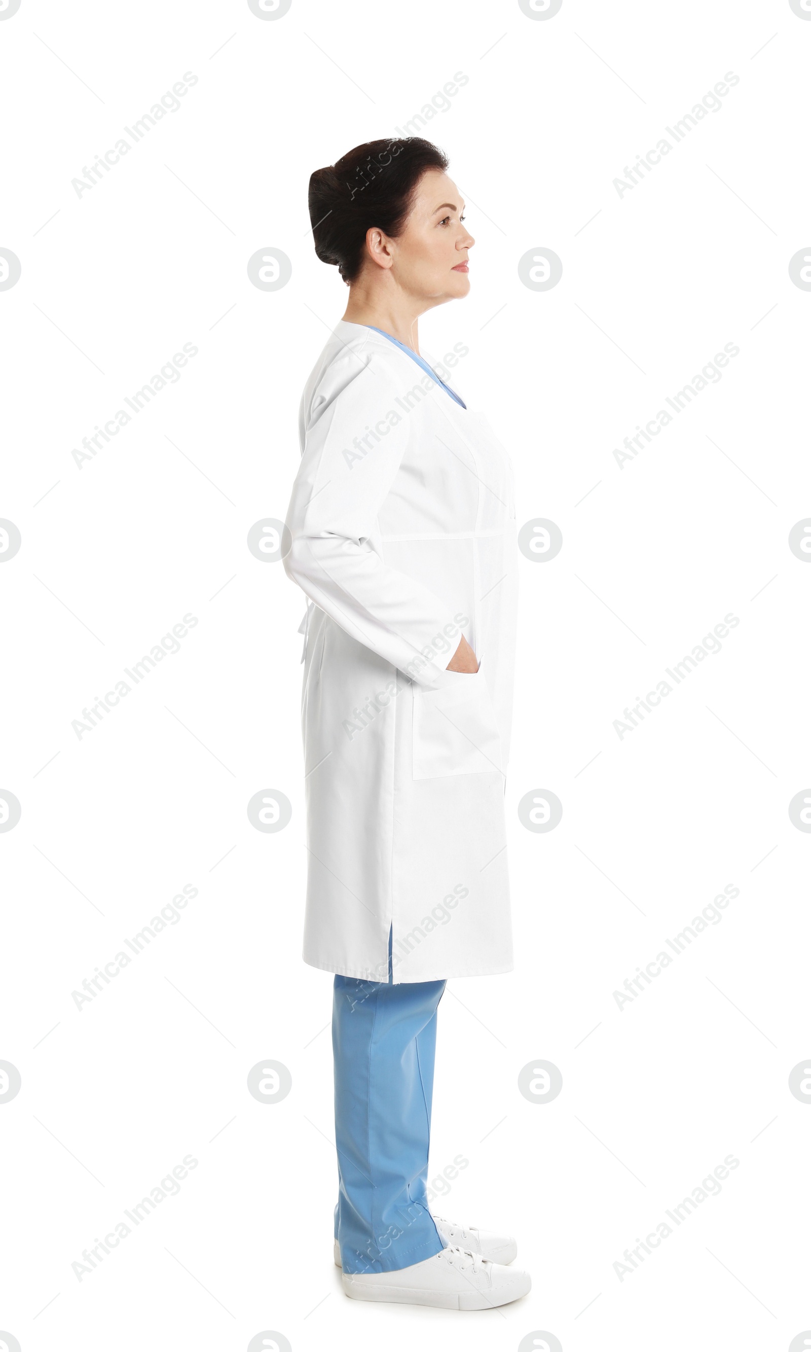 Photo of Full length portrait of female doctor isolated on white. Medical staff