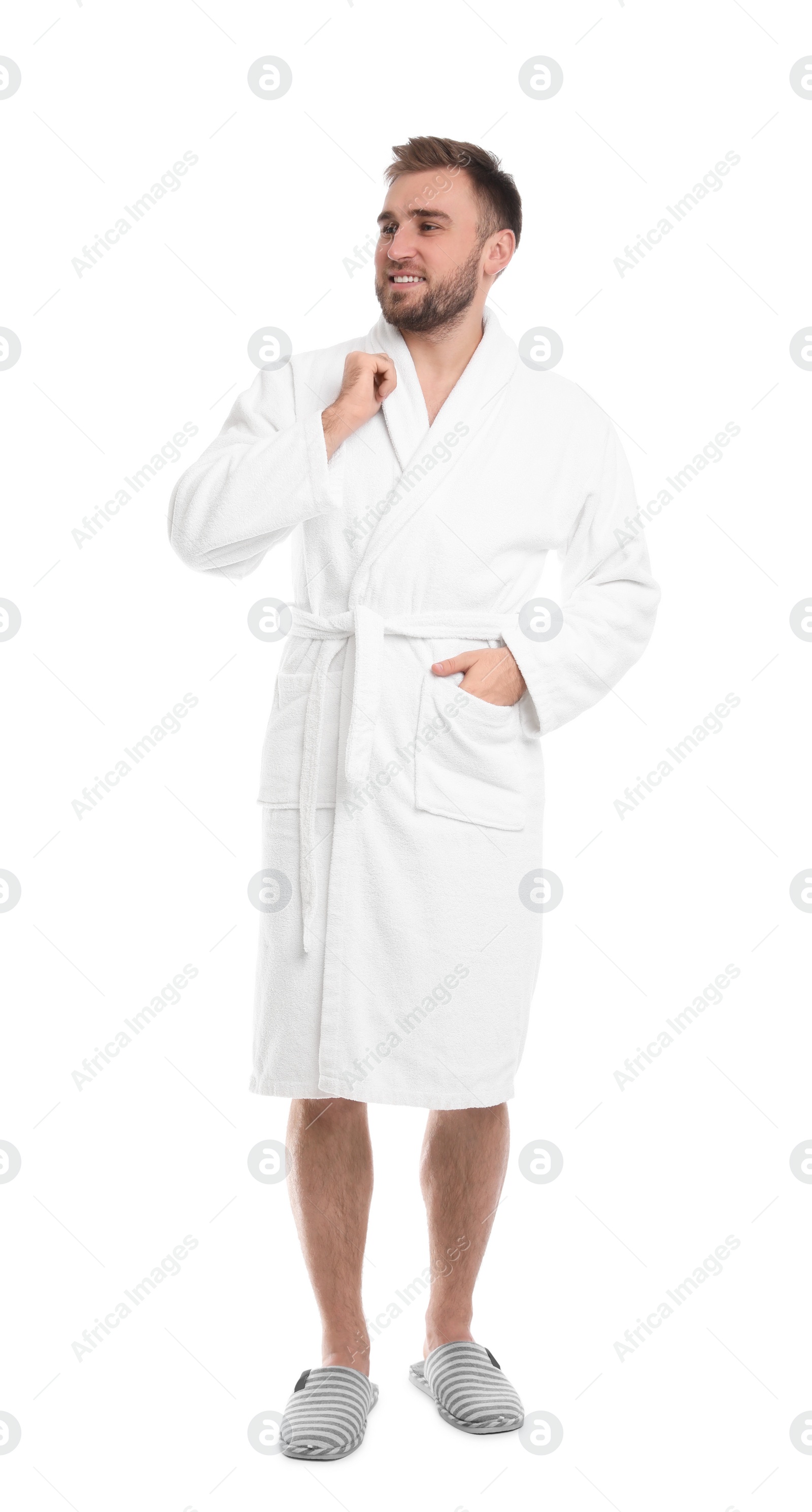 Photo of Handsome man wearing bathrobe on white background