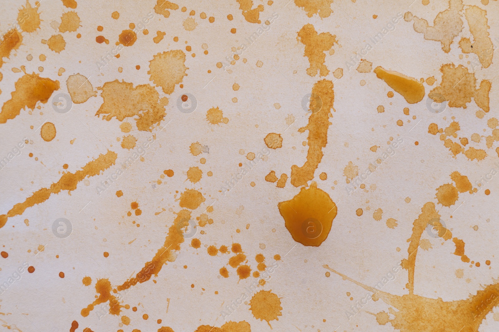 Photo of Abstract watercolor painting with orange blots as background, top view