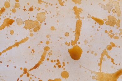 Photo of Abstract watercolor painting with orange blots as background, top view