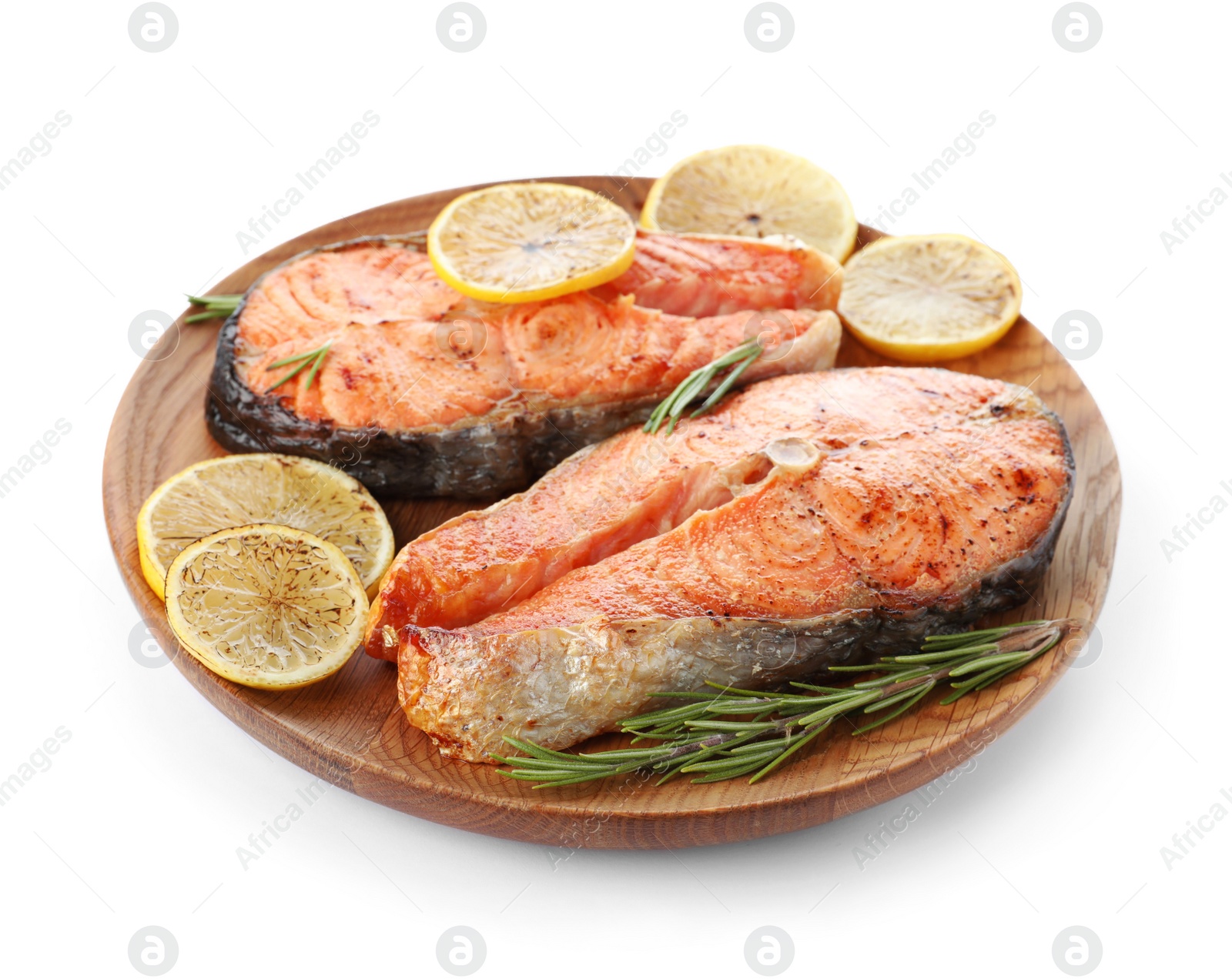 Photo of Wooden plate with tasty cooked red fish isolated on white