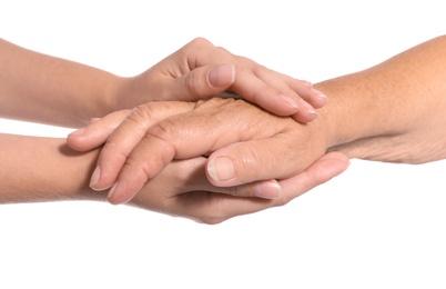 Photo of People holding hands together on white background. Help and elderly care service