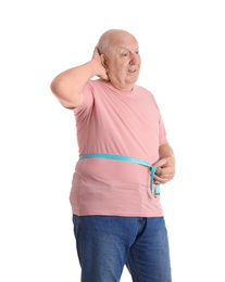 Fat senior man with measuring tape on white background. Weight loss