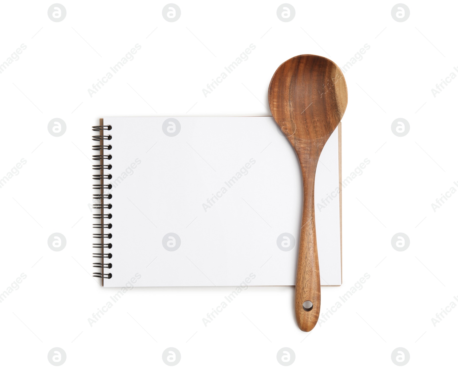 Photo of Blank recipe book and wooden spoon on white background, top view. Space for text