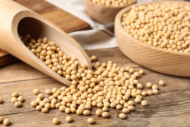 Photo of Natural organic soy beans on wooden table