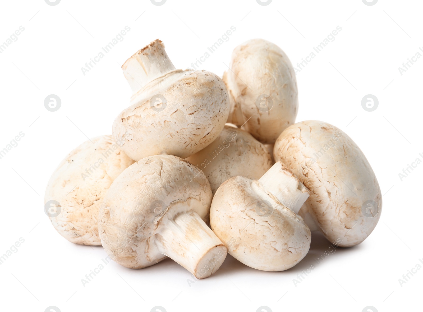 Photo of Fresh champignon mushrooms isolated on white. Healthy food