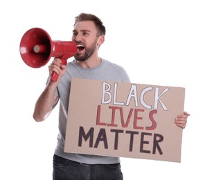 Photo of Emotional man shouting into megaphone while holding sign with phrase Black Lives Matter on white background. End Racism