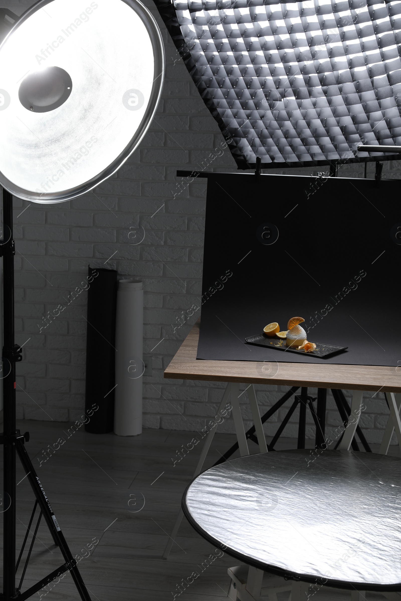 Photo of Beautiful composition with delicious dessert on black background in studio. Food photography