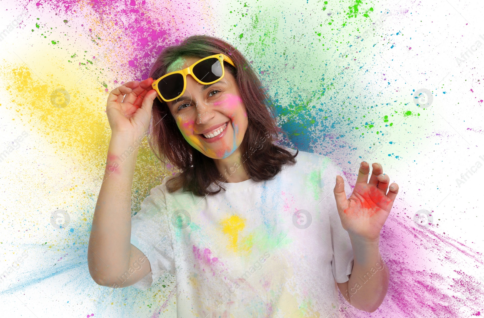 Image of Holi festival celebration. Happy woman covered with colorful powder dyes on white background