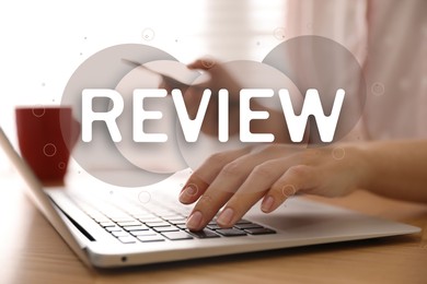 Image of Online review. Woman using laptop and mobile phone to leave feedback, closeup