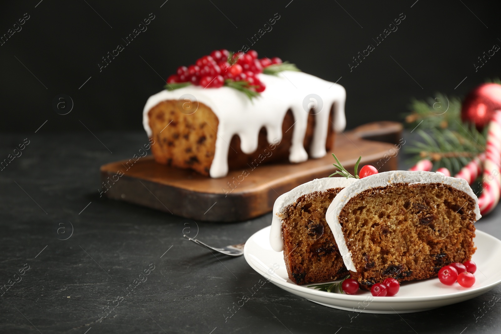 Photo of Traditional Christmas cake on black table, space for text. Classic recipe