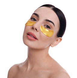 Photo of Beautiful young woman with under eye patches on white background