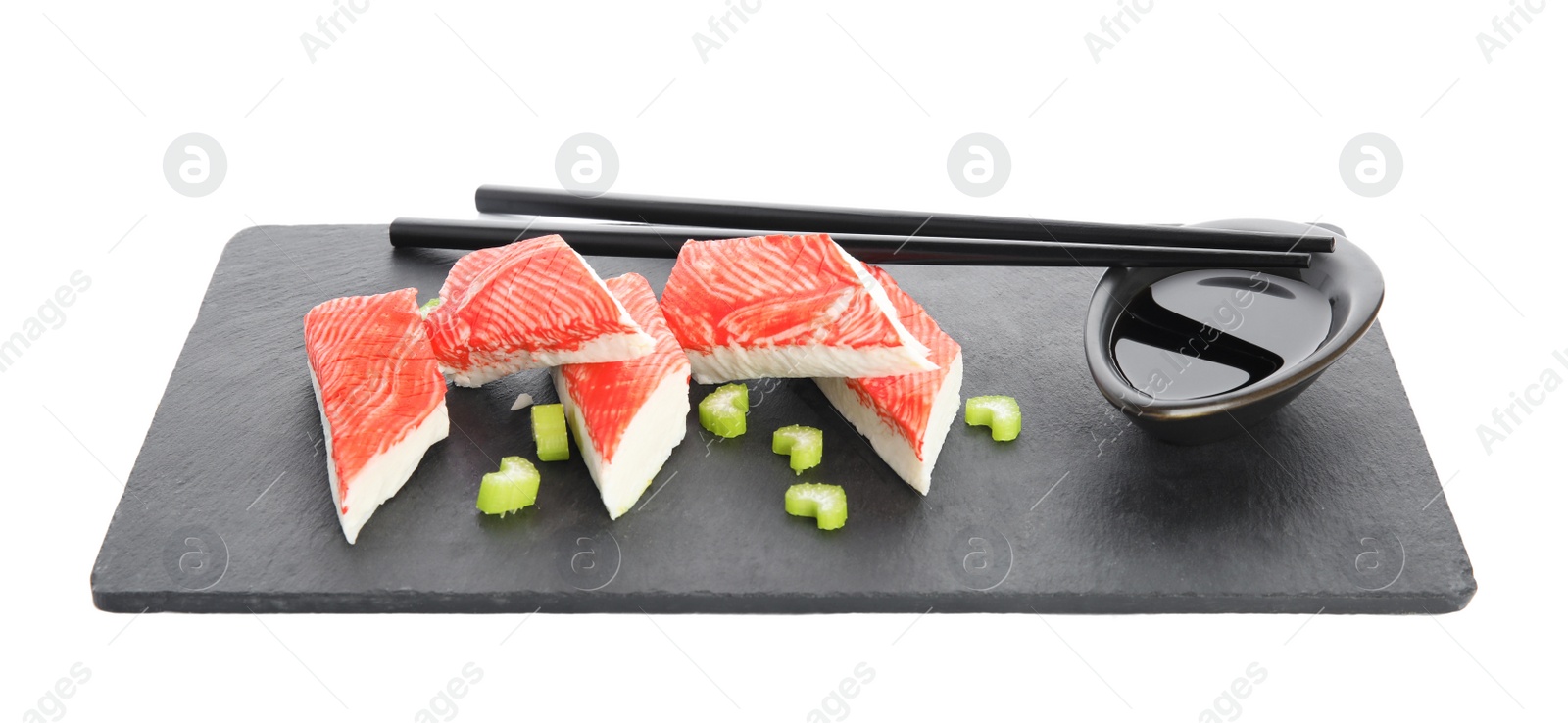 Photo of Fresh crab sticks with celery and soy sauce on white background