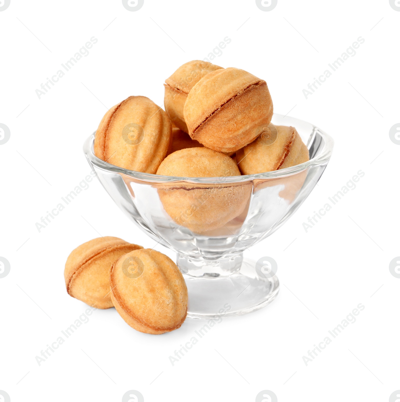 Photo of Glass dessert bowl and delicious nut shaped cookies on white background