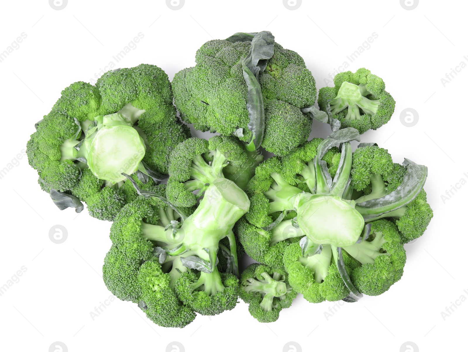 Photo of Pile of fresh raw green broccoli isolated on white, top view