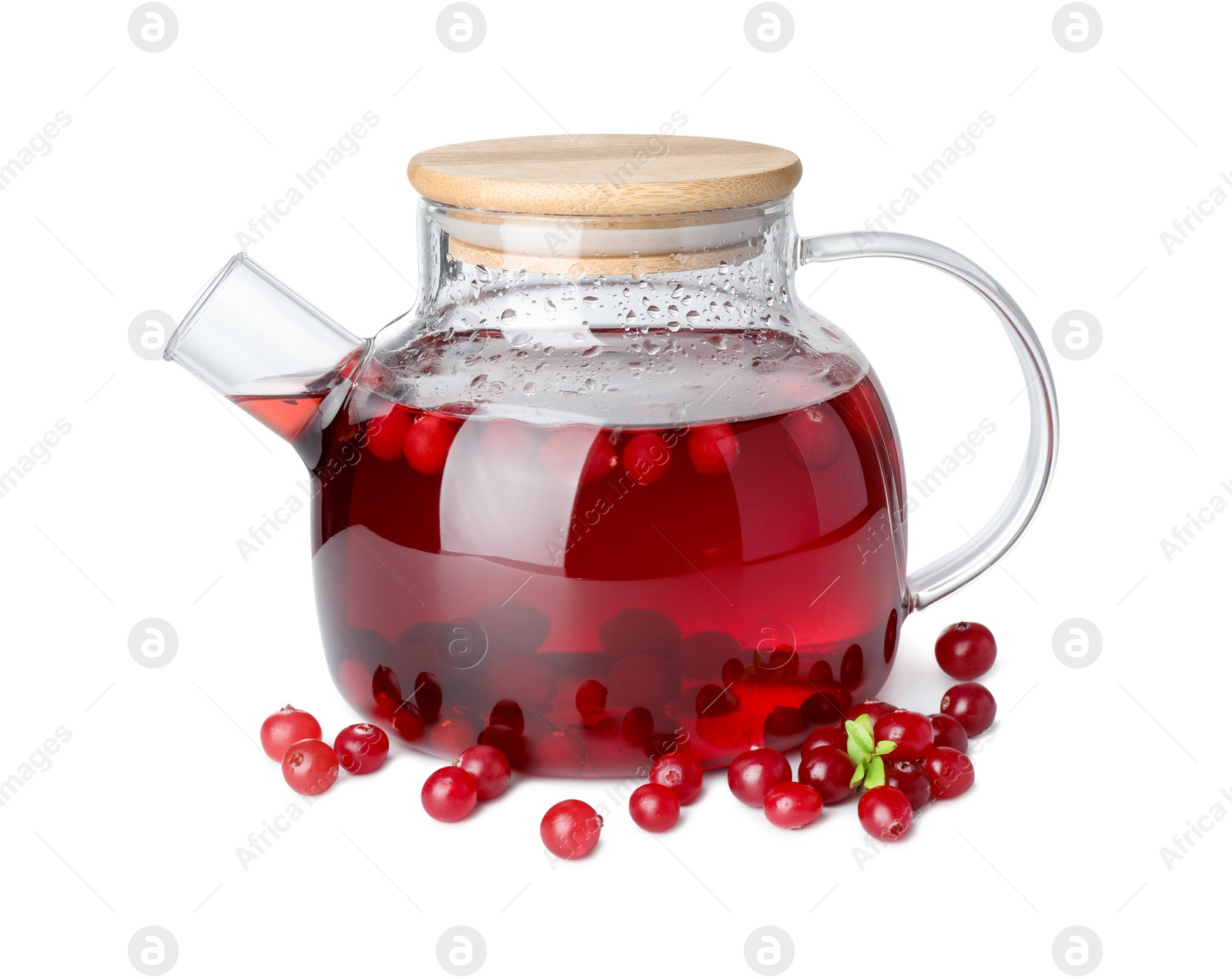 Photo of Tasty hot cranberry tea in teapot and fresh berries isolated on white