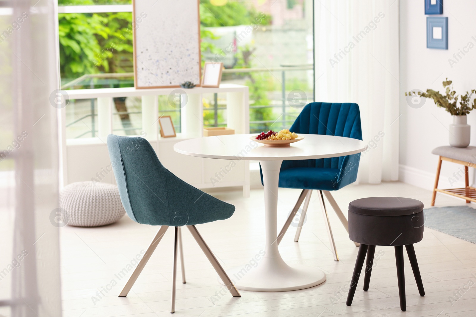 Photo of Modern dining room interior with table and chairs