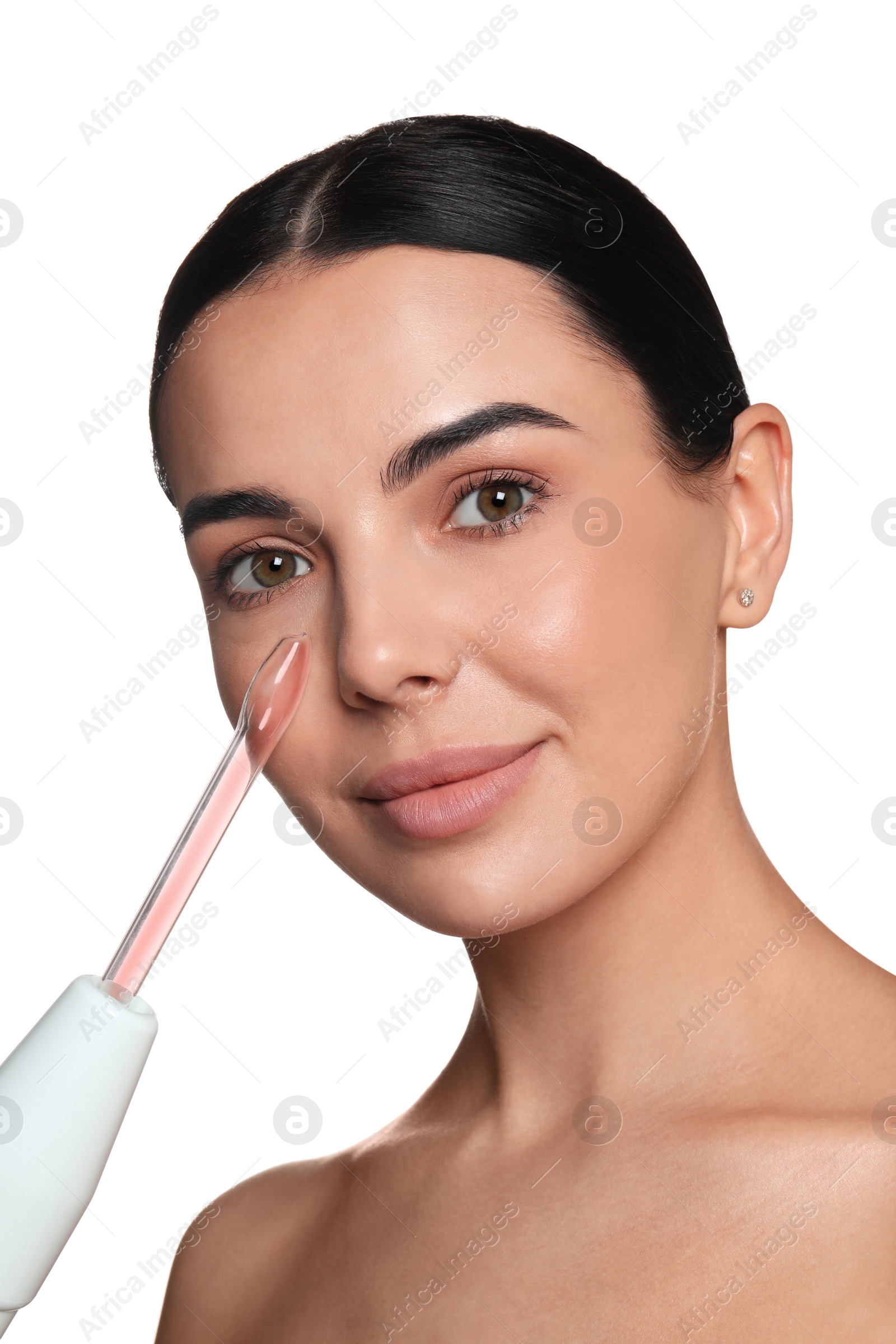 Photo of Woman using high frequency darsonval device on white background