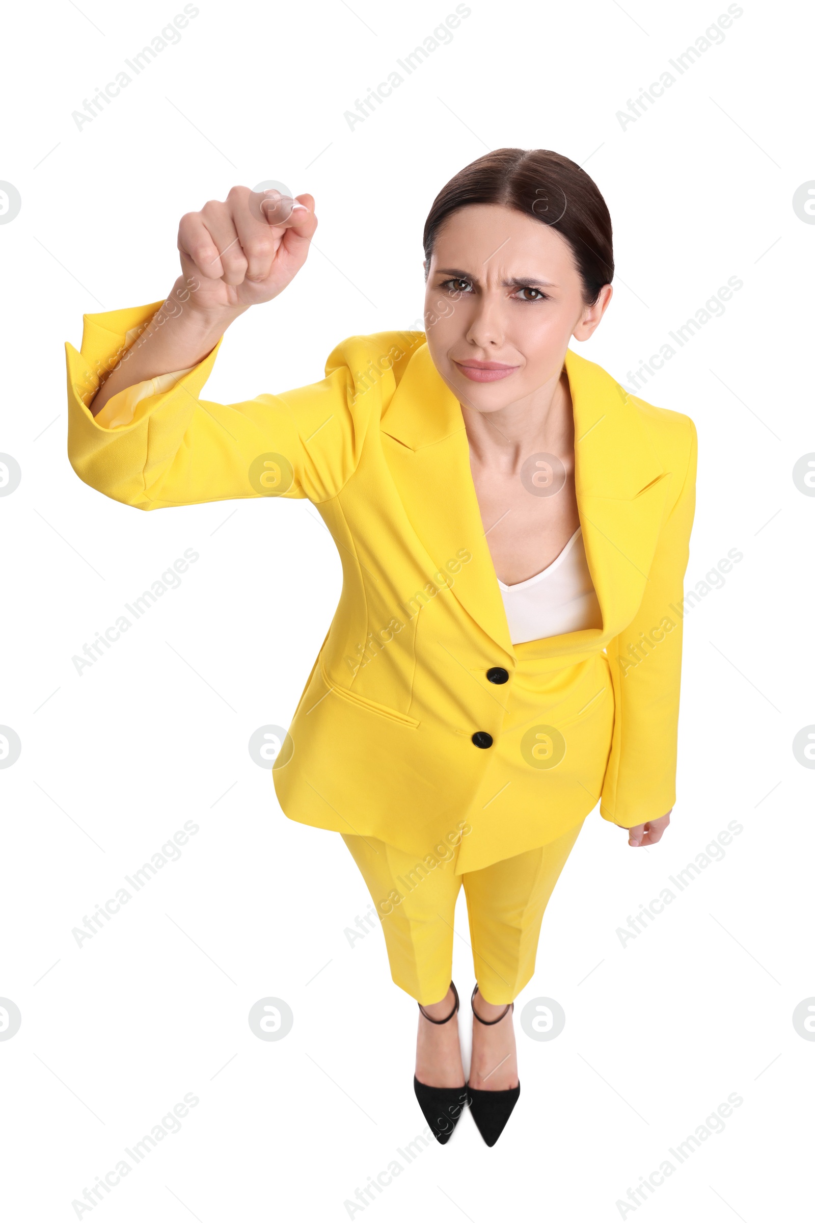 Photo of Beautiful businesswoman in yellow suit pointing at something on white background, above view