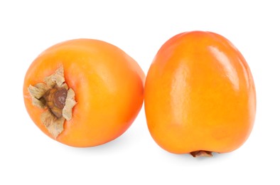 Photo of Delicious ripe juicy persimmons isolated on white