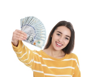 Portrait of happy young woman with money on white background