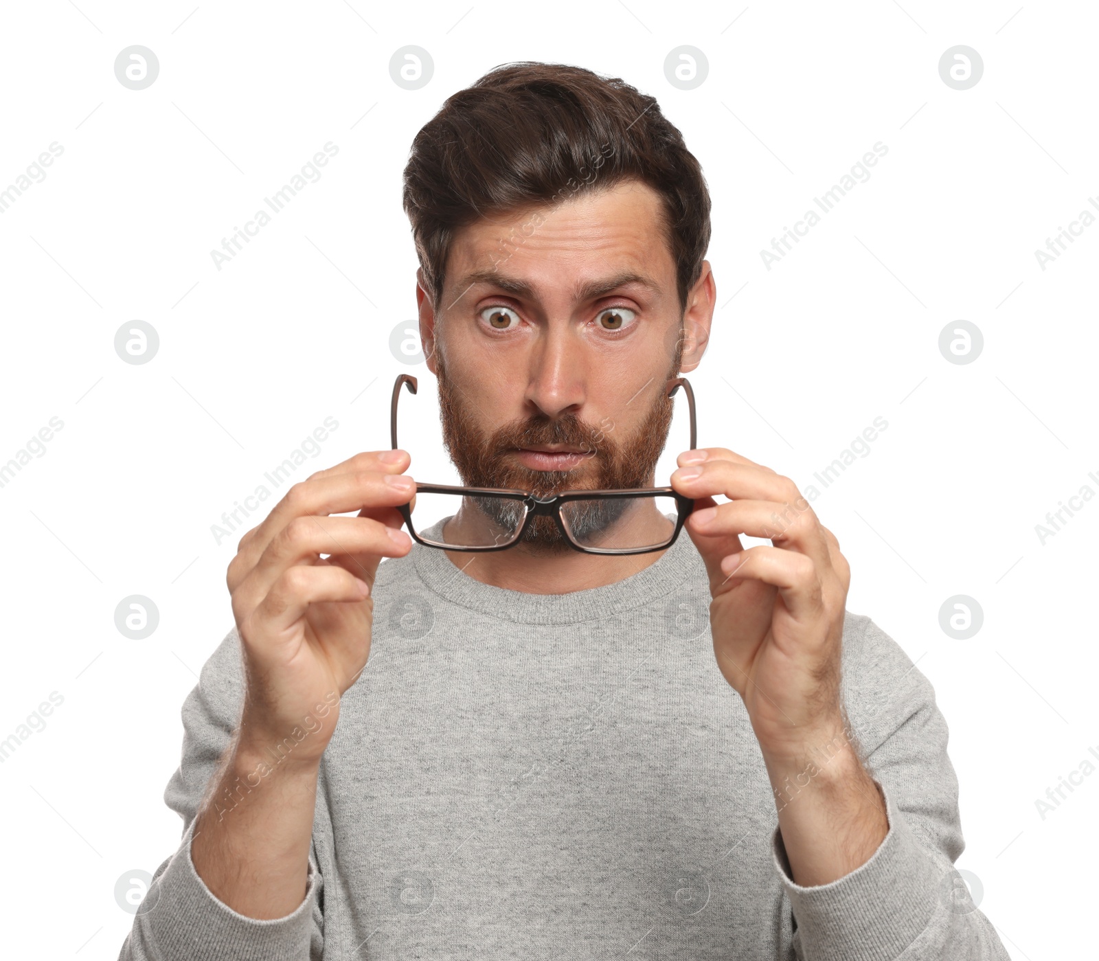 Photo of Man suffering from eyestrain on white background