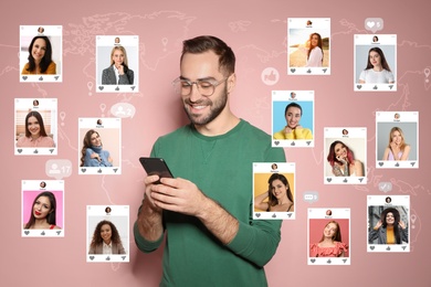Image of Handsome man visiting online dating site via smartphone on pink background