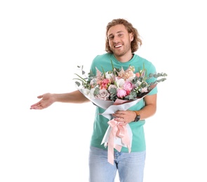 Young handsome man with beautiful flower bouquet on white background