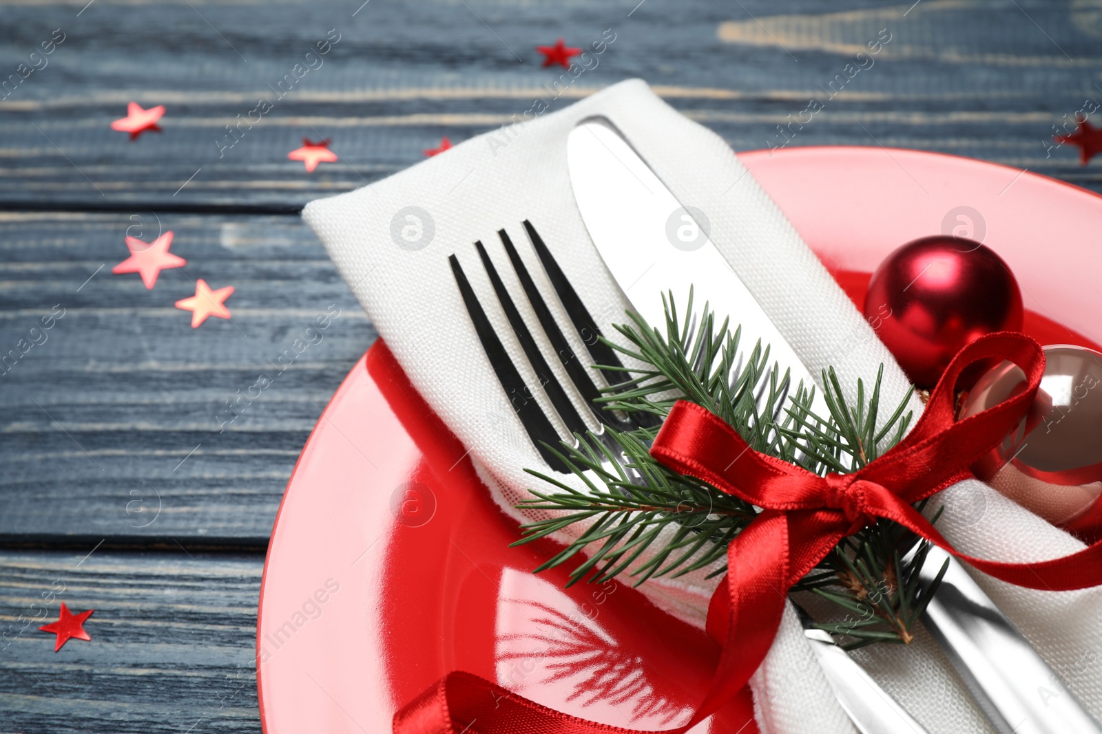 Photo of Christmas table setting on blue wooden background, closeup