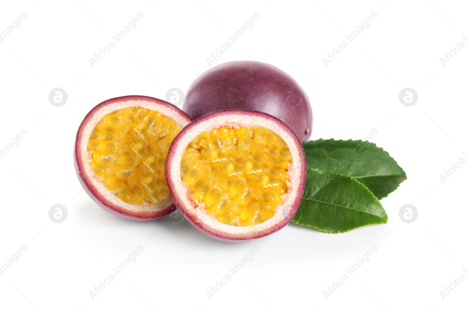 Photo of Delicious passion fruits (maracuya) and green leaves on white background
