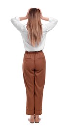 Businesswoman standing on white background, back view