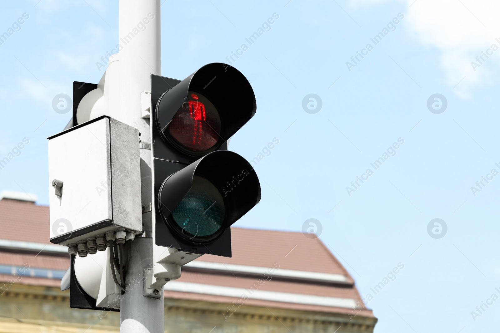 Photo of Post with traffic light for pedestrians in city