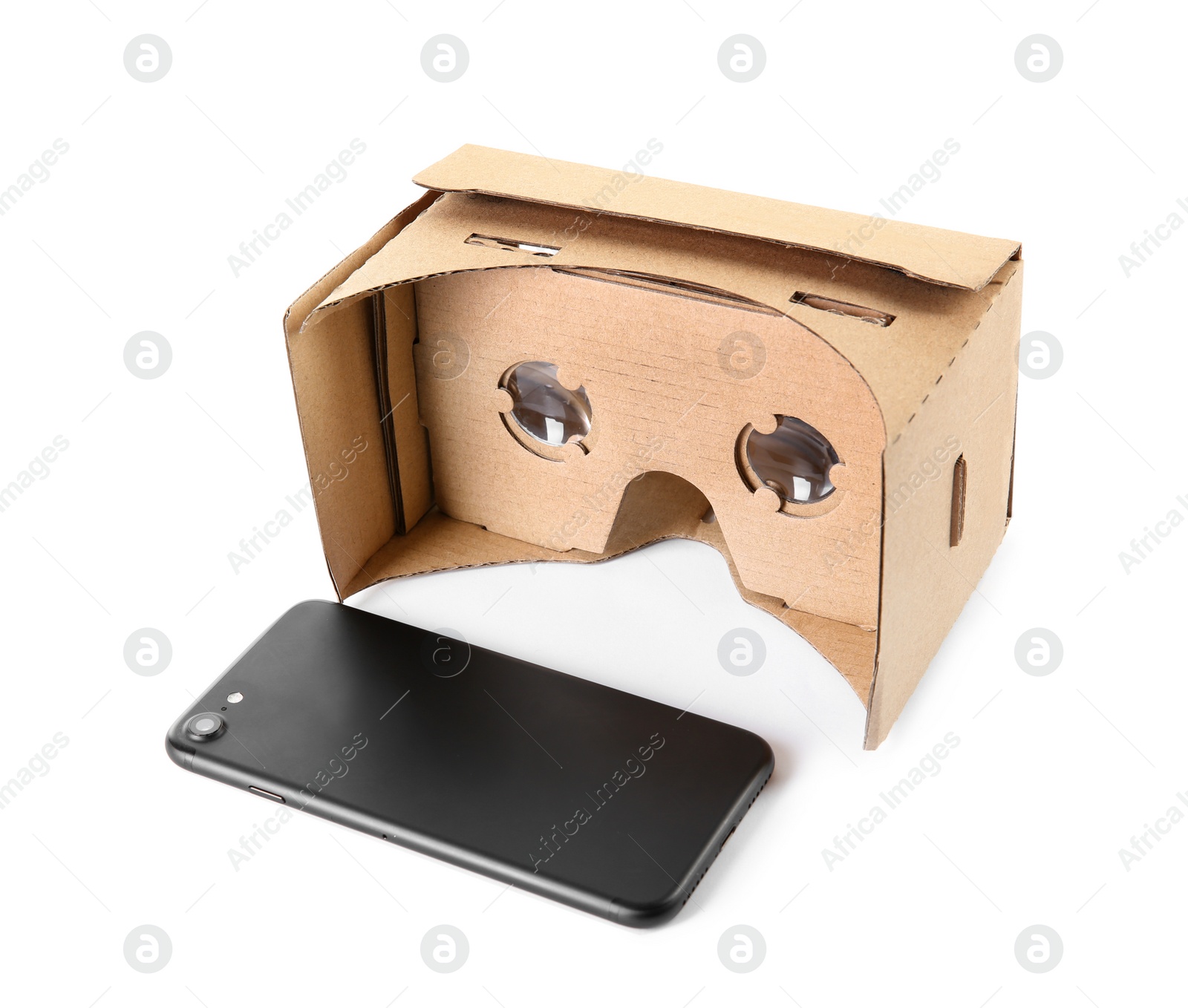 Photo of Cardboard virtual reality headset and smartphone on white background